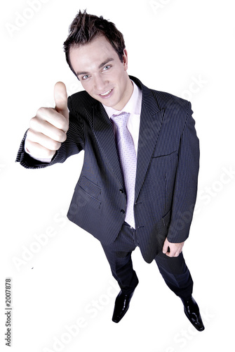 Young businessman in suit showing thumb up