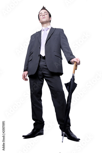 Young man in suit with umbrella 