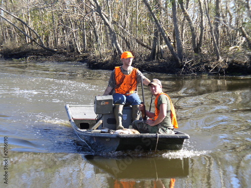 hunters in a mud boat