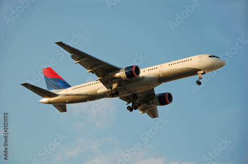 modern passenger jet arriving at destination photo