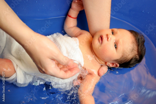 a baby girl in a bathtub photo