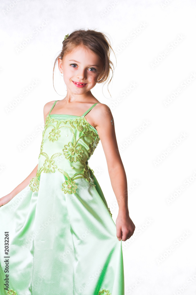 portrait of the girl of preschool age, in green dress on a white portrait of the girl of preschool age, in green dress on a white