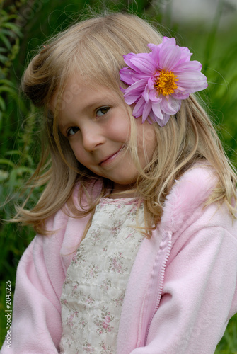 the little girl with a flower in hair