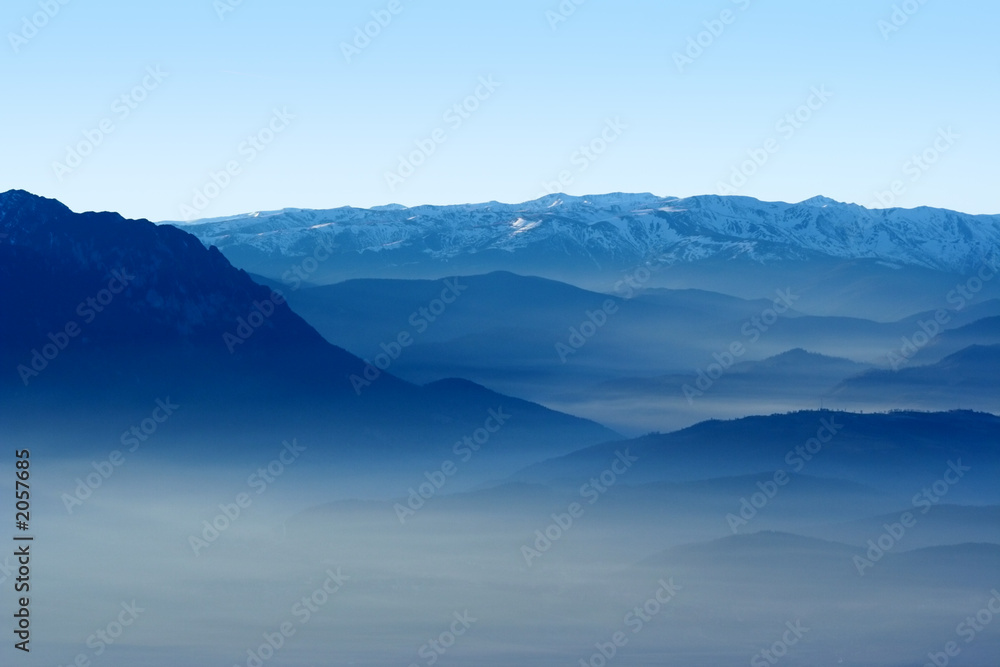 mountains and valley in the fog