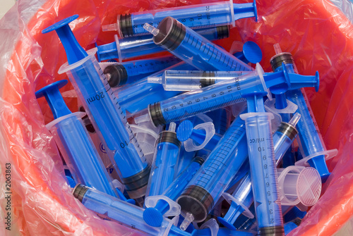 syringe in recycle bin