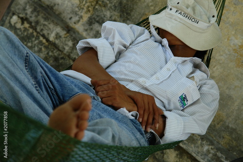 man sleeping in a hammock