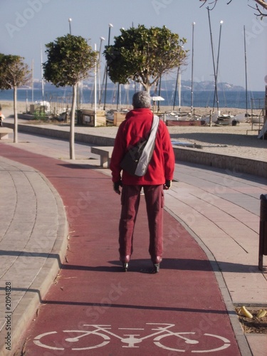 red man rollerblading on cycle lane photo