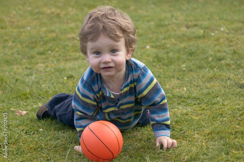 toddler playing with a ball
