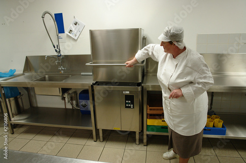 chef operating professional dishwasher