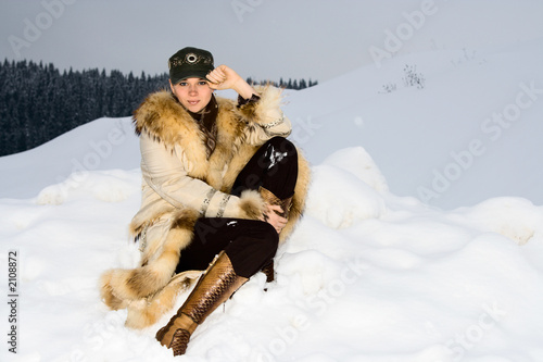 portrait of the fine girl on a snow photo