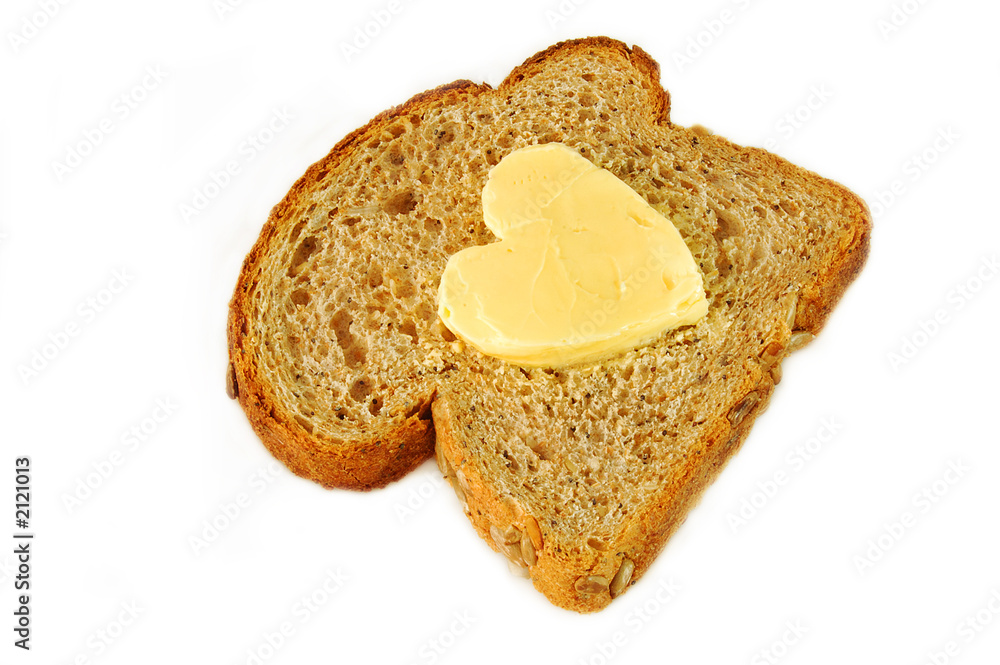 seeded wholegrain bread and heart shaped butter. seeded wholegrain bread and heart shaped butter.