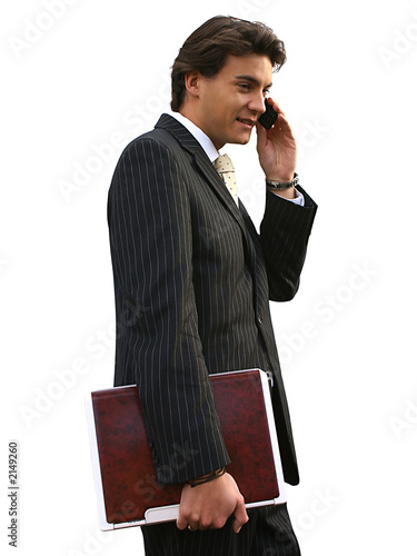 young man with laptop and cell phone