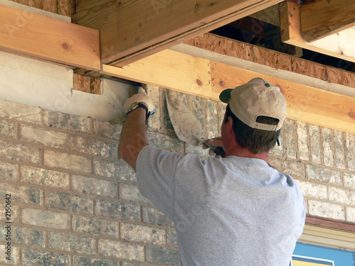 mason lays brick