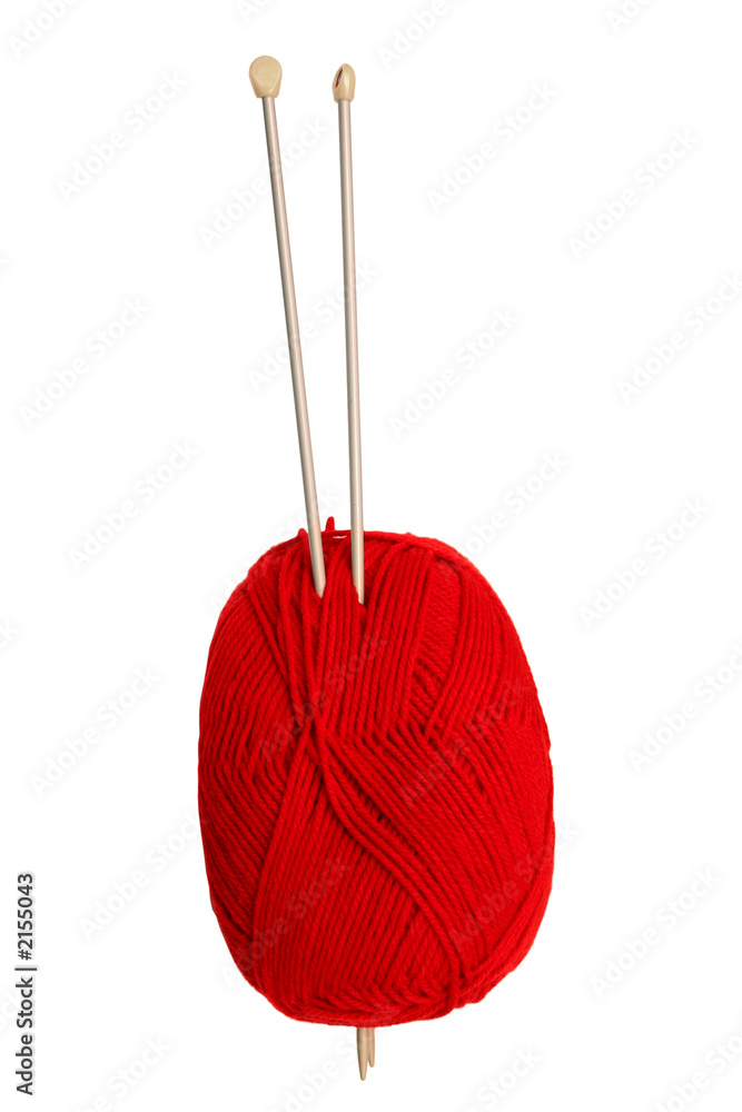 a red ball of wool and knitting needles. a red ball of wool and knitting needles.