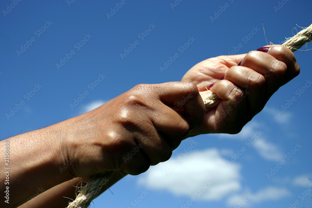 hands pulling on rope
