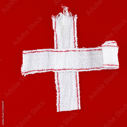cross made of white bandages (red background)