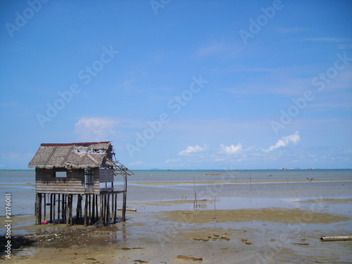 single abandoned hut by the beach