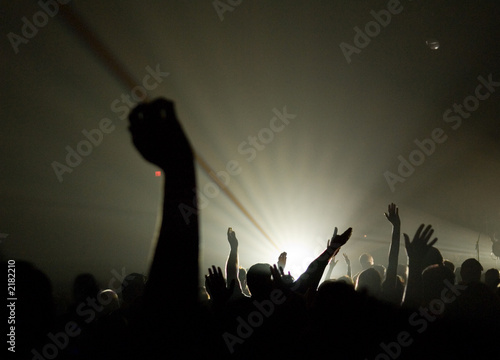 musical concert - christian - with uplifted hands worshipping