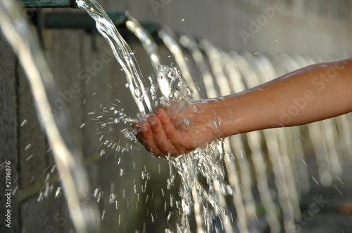 splashing in a waterfall on a hot summer day