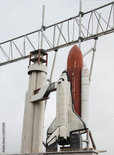 space shuttle and booster rockets on launchpad