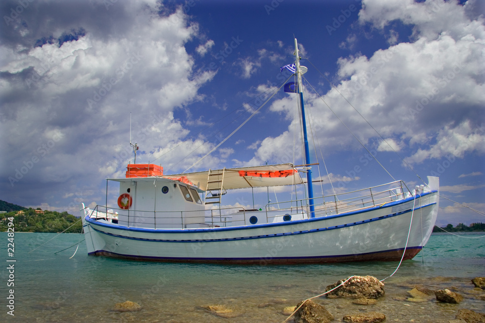 sailing boat anchored at the seaside in corfu isla