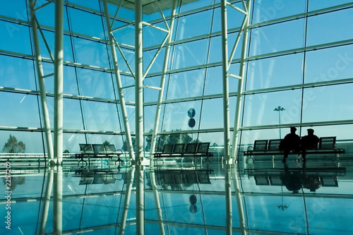 people silhouette in the waiting lounge in airport