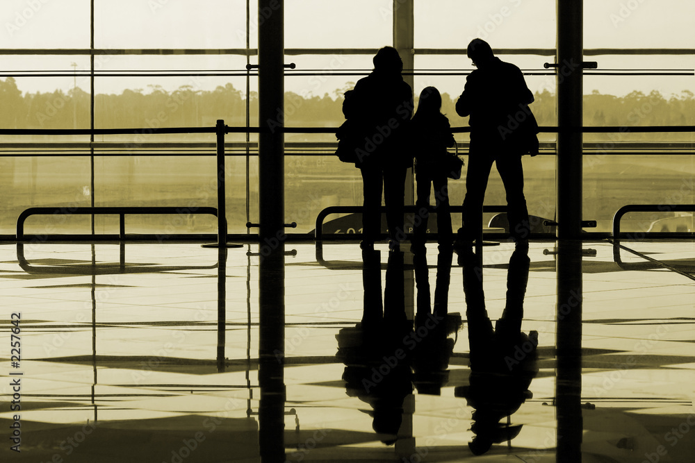 family waiting at the international airport terminal family waiting at the international airport terminal