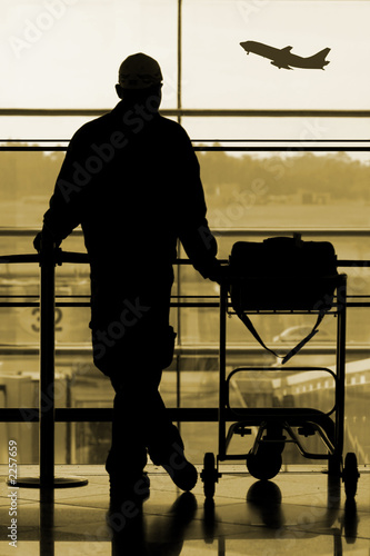 man waiting at the international airport terminal