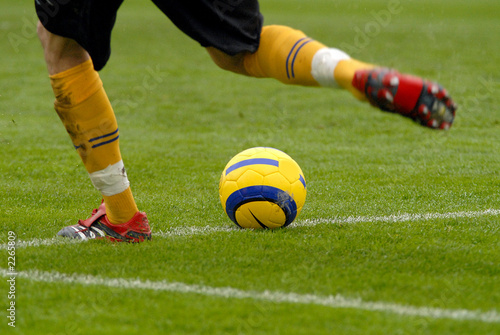 the football goalkeeper beats out a ball