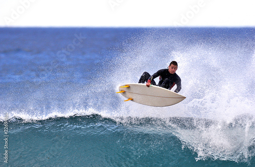 Картината върху платно surfer executing an ariel maneuver