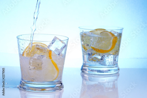 pouring vodka into cocktails