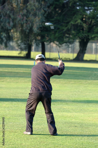 golfer concentrating on swing