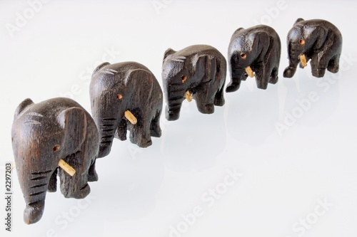 Photography five wooden elephants at a row