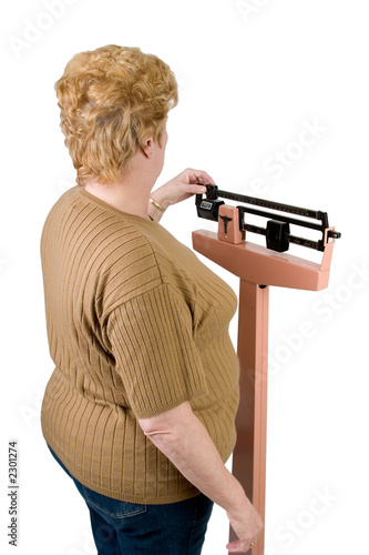 over the shoulder look at a woman checking her weight