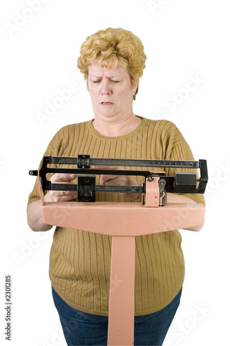 woman checking her weight on scale with path