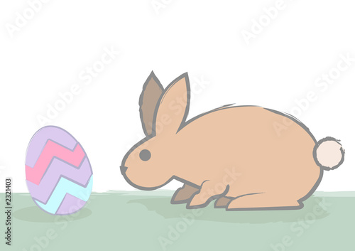 cautious bunny sniffs the egg