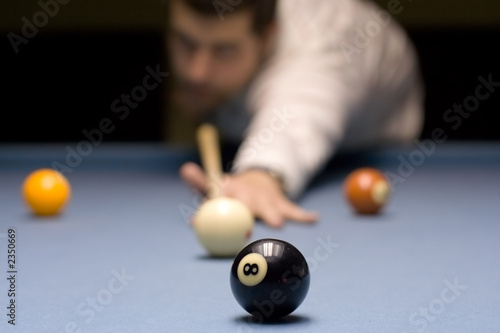 young person playing snooker