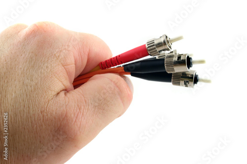 fiber optic computer cable held in the hand
