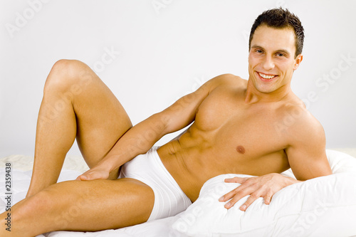 man lying in the bed photo