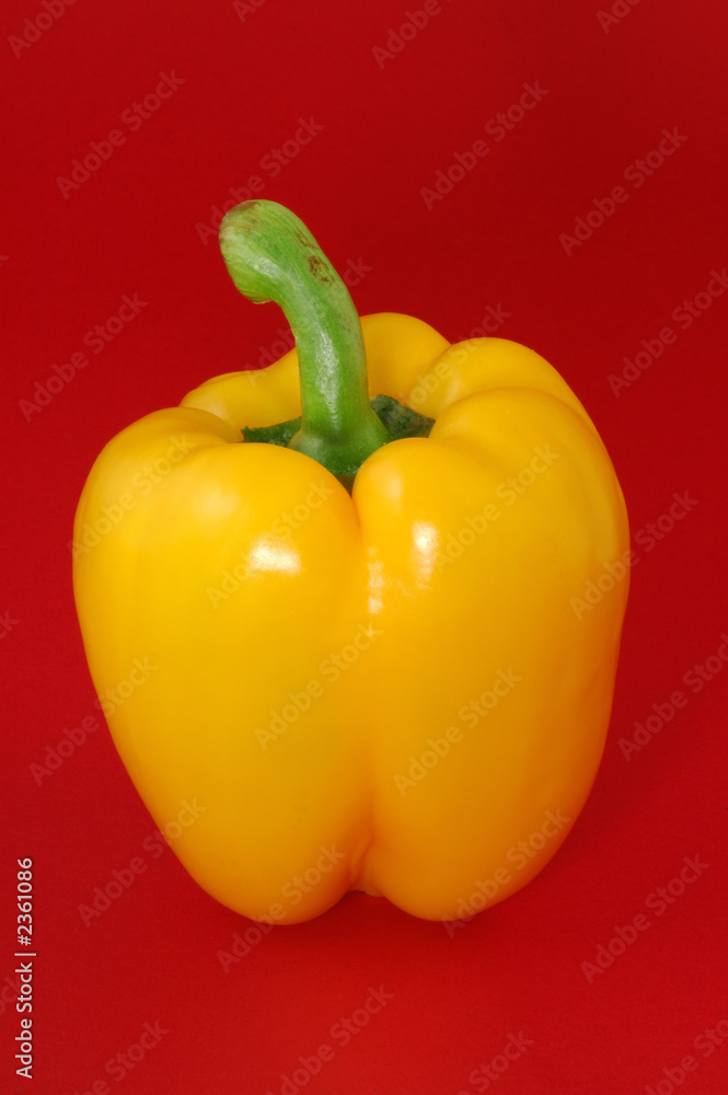 yellow sweet bell pepper over red background