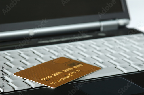 gold credit card and notebook