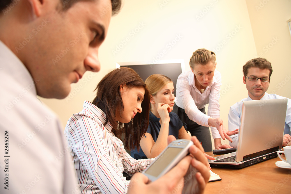 Fototapeta premium five business people working together in office en