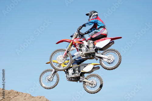 dirt bikes jumping in the air