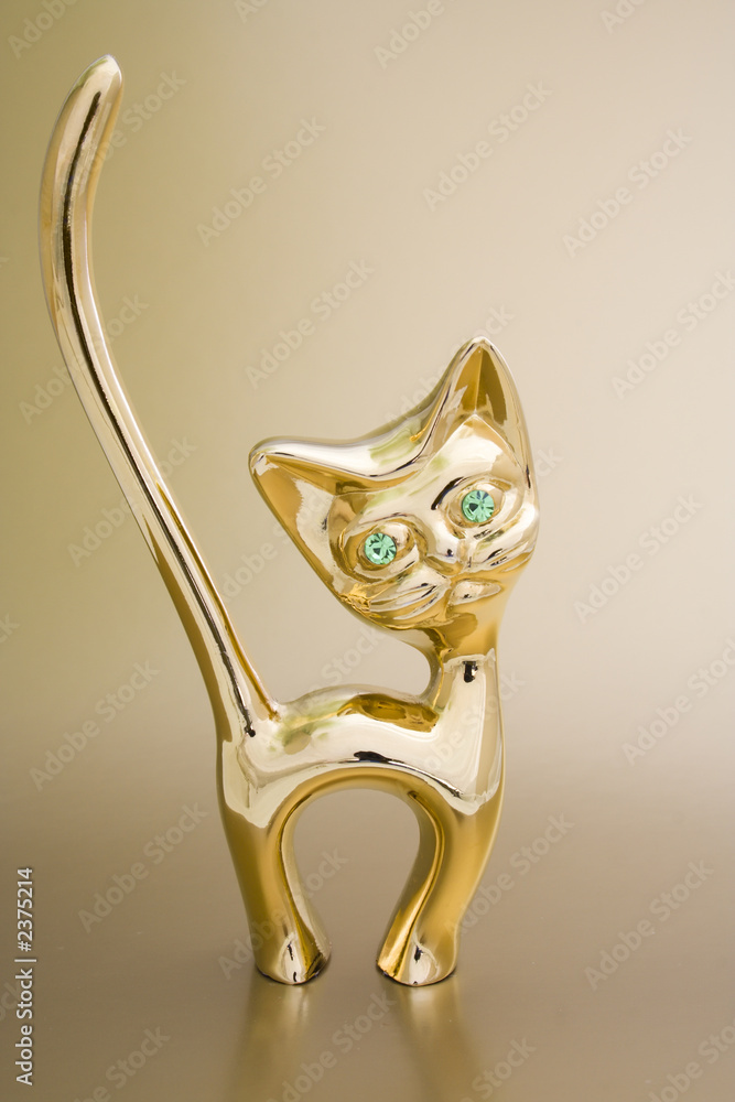 Fototapeta premium aureate holder for rings in the form of cat