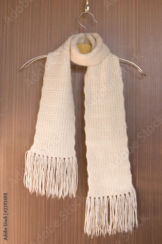 knitted scarf on a hanger.