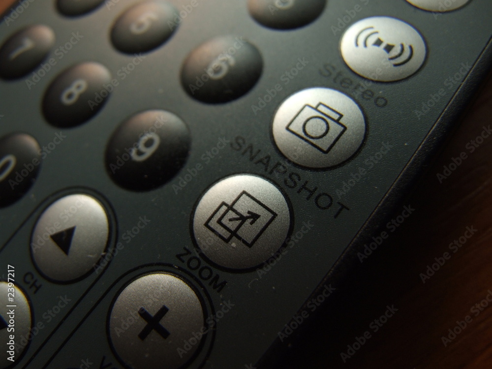 thin remote closeup with snapshoot button in focus thin remote closeup with snapshoot button in focus