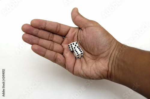 pair of dice in a hand