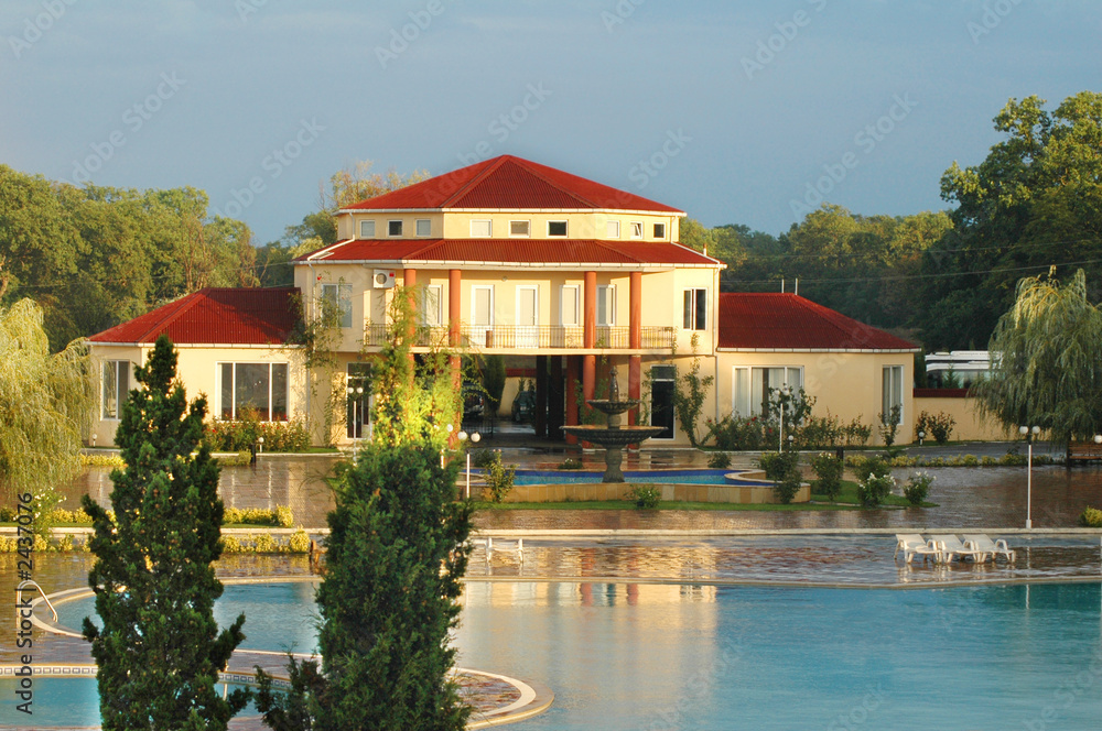 big summer house with swimming pool in summer