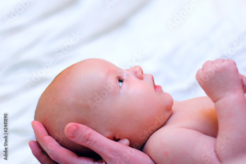 mother hold baby in hands
