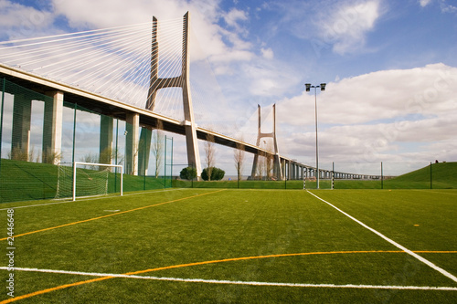 Canvas-taulu soccer field by the bridge